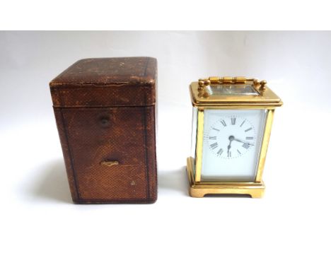 A 20th century French brass cased carriage clock with white enamel dial and Roman numerals, and a single train movement, 11cm
