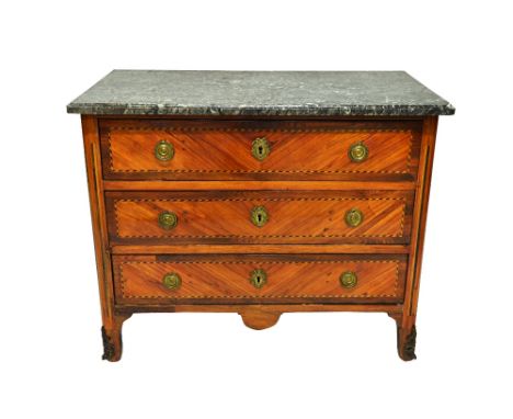 An 18th century French commode, the marble top over a tulipwood and kingwood three drawer gilt metal mounted base, on scroll 