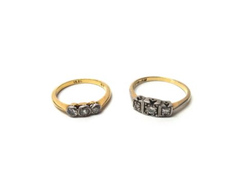 A gold and platinum, diamond set three stone ring, mounted with circular cut diamonds within square shaped settings, detailed