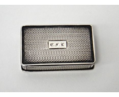 A William IV silver rectangular vinaigrette, the exterior with engine turned decoration, having a floral and scroll engraved 