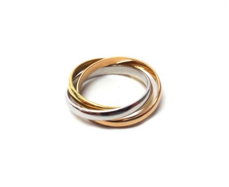 A three colour gold 'Trinity' or Russian style wedding ring, indistinctly stamped 'Cartier 18 K' ring size P and a half, gros