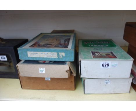 Four GWR wooden jigsaw puzzles by Chad Valley; 'The Vikings Landing St Ives', 'The Model Railway' (2) and 'Paddington Station