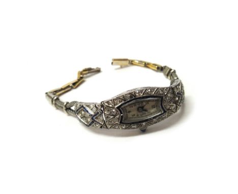 A lady's diamond and synthetic sapphire set bracelet wristwatch, with an unsigned oval movement, the case surround mounted wi