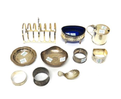A collection of silver wares, comprising; a silver six division toast rack, Birmingham 1924, a George III silver oval salt wi