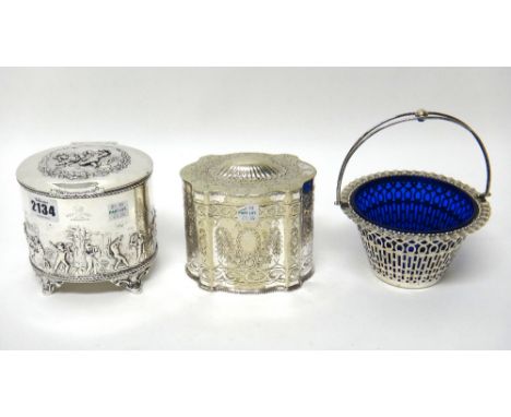 A silver tea caddy, of hinge lidded oval form, the body and the lid decorated with merrymaking classical figures in landscape