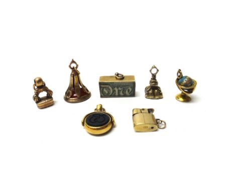 A gold mounted bloodstone and sardonyx set rotating fob seal, a cornelain set pendant fob seal, two further Victorian seals, 