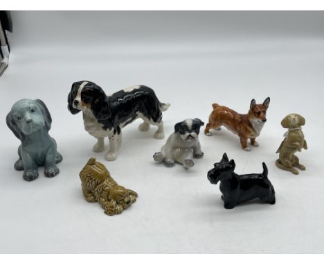 Collection of Seven Dog Figurines to include Rare Wade, Beswick England, DJ Copenhagen Denmark, Royal Doulton, and Wade. 
Goo