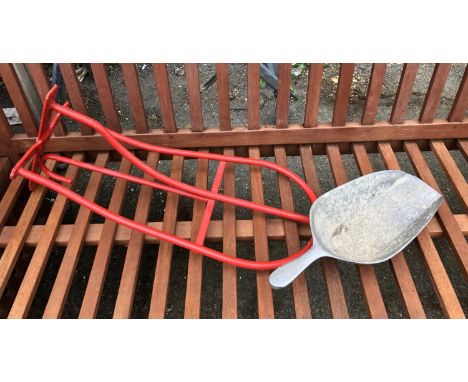 A red saddle and bridle rack, together with a feed trowel 