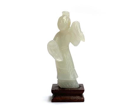 A Chinese celadon jade figure of a scholar, approx. 8cmH, on hardwood base