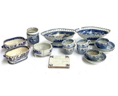 A mixed lot of mainly Willow pattern ceramics to include scalloped footed dishes, majolica tile, tureens (mainly Stone China)