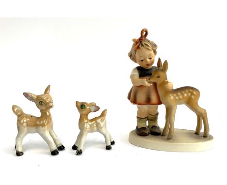 A Goebel figurine of a girl and deer fawn, 12.5cmH; together with two vintage Chinese deer fawn figurines 