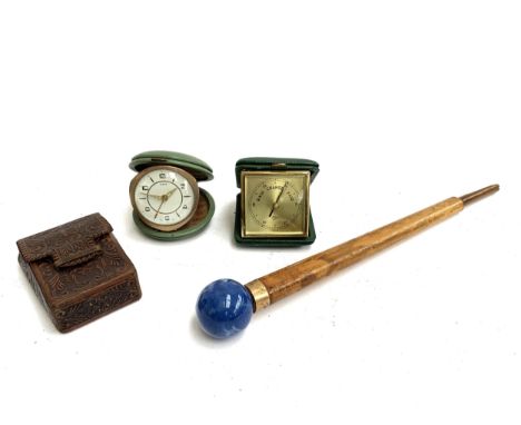 A mixed lot to include an Oris travel clock, a Barigo, Portugal barometer, a leather card case and a walking stick handle wit