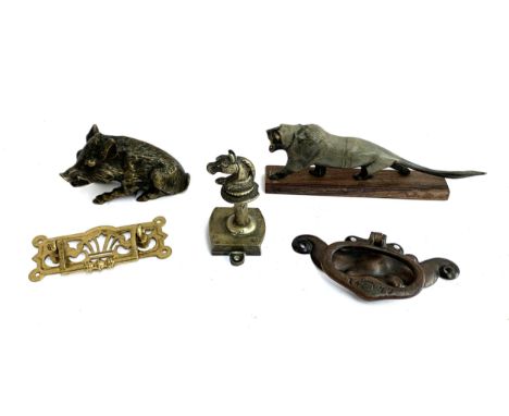 A quantity of brass castings to include wild boar sculpture, horse-head hanger, Arts &amp; Crafts door knocker, African bone 