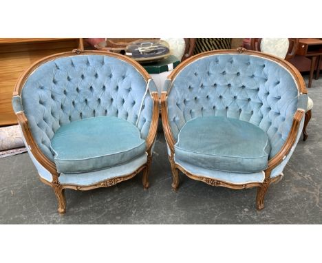 A pair button back armchairs, with carved beechwood frames, approx. 85cmW 