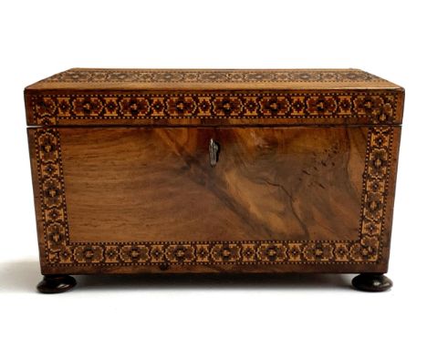 A 19th century Tunbridge ware tea caddy, of sarcophagus form, the lid with a central depiction of Eridge Castle surrounded by