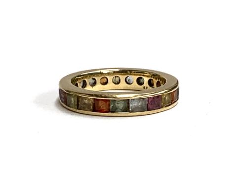 A 9ct gold and channel set multi-coloured topaz eternity ring, size N, approx. 4.2g 