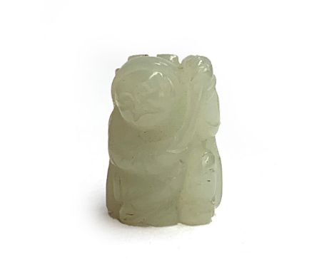 A small Chinese celadon jade figure of a boy holding a leafy lotus stem, 2.7cmH, with central drilled hole, on a fitted hardw