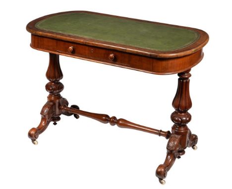 A Victorian mahogany writing table, the rectangular leather inset top with rounded ends, the frieze drawer with a hinged writ