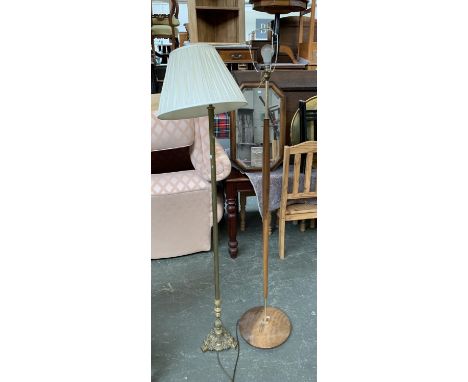 A gilt metal standard lamp, with shade, together with a mid century turned wood standard lamp 