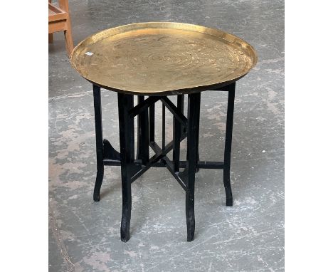 An Indian brass tray on folding stand, 60cmD approx. 