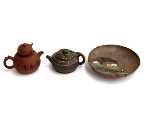 A Yixing clay Chinese teapot, marks to base, 11cmH, together with one other with spider web motif and a small Chinese plate d