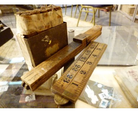 Three Rabone vintage rulers and a set of metal number carpentery stamps 