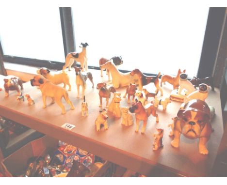 Shelf of ceramic dogs including Sylvac 