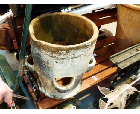 Cast iron end wood slat garden bench and an earthernware garden herb pot