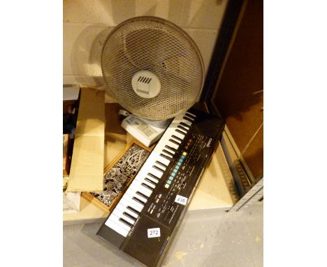 Casio electric organ and a desk fan