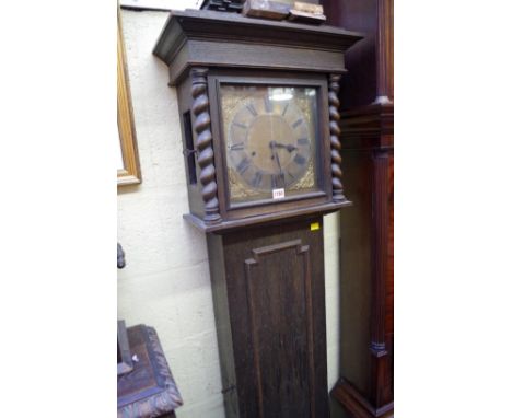 An oak longcase clock,&nbsp;striking on straight gongs, 185.5cm high, lacking pendulum.&nbsp; 