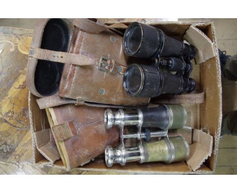 Two pairs of field glasses,&nbsp;one with broad arrow stamp, each in tan leather case. 