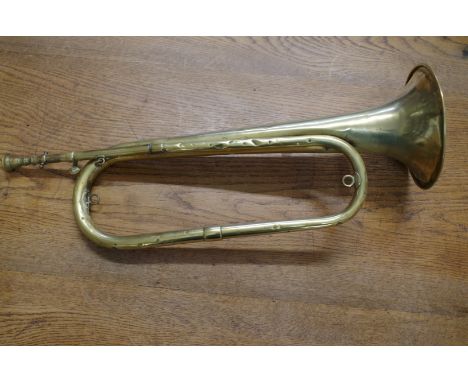 A 19th century brass bugle,&nbsp;inscribed 'Etesse, Fournisseur de l'Armee, Tours'.By family repute brought back from the bat