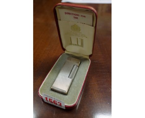 A Dunhill 'Rollagas' electroplated lighter,&nbsp;boxed and with instructions. 