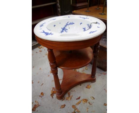 A Victorian blue and white pottery basin,&nbsp;probably Mintons, decorated with birds on branches, 64cm diameter, (s.d.), on 