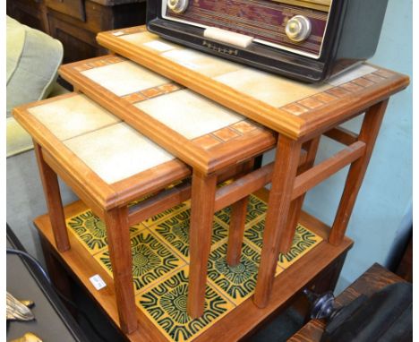 An Anbercraft mid century nest of three tile topped tables