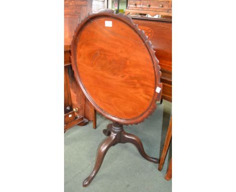 A 19th century mahogany circular tilt top tripod table with decorative edging, 66cm high