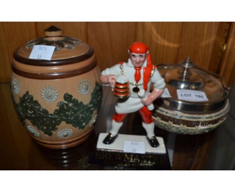 A "Wade" Brewmaster figure 13 cm high, a Doulton Lambeth tobacco jar and a Villeroy and Boch bowl with plated lid and handle 