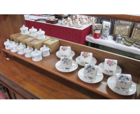 A set of 6 Royal Worcester coffee cups and saucers and 9 boxed Russ trinket boxes