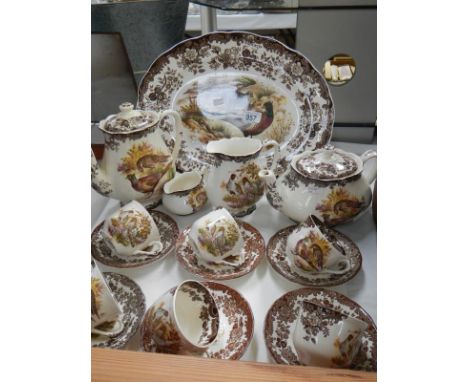 A 17 pieces of Royal Worcester Palissy game bird tea ware including cups, saucers, teapot, serving dish etc