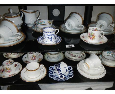2 shelves of interesting cups and saucers