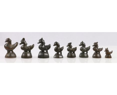 Eight Chinese bronze opium weights in the form of birds.
