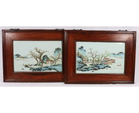 Pair of mid 20th century Chinese porcelain plaques, framed in simple rosewood frames depicting pavilions in a watery landscap