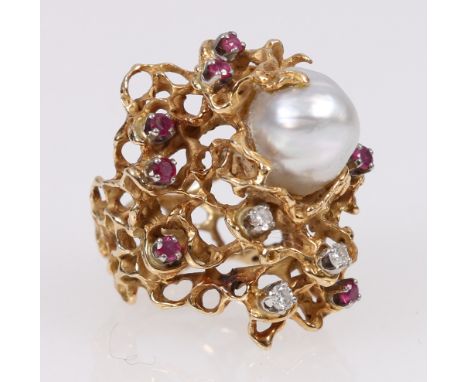 1970's diamond pearl and ruby ring, abstract textured mount, the baroque pearl measuring 12mm long, the three round brilliant
