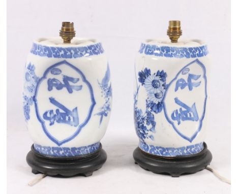 Pair of Chinese 20th century blue and white ceramic lamp bases shaped as pillows, calligraphy and floral decoration, 22cm (2)