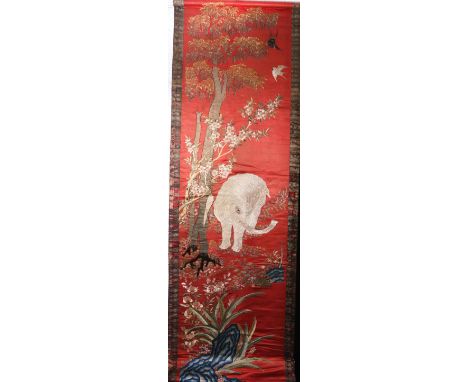 Chinese 19th century finely embroidered scroll panel depicting an elephant amongst multiple flowering trees and plants, on a 