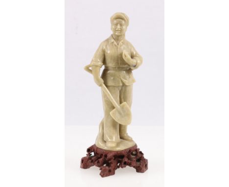 Mao period Chinese soapstone carving of a female labourer holding a spade, 19cm. CONDITION REPORT: Blue patch or stain under 