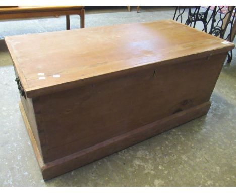 Late 19th Century pine trunk of rectangular form with metal loop carrying handles. (B.P. 21% + VAT)Worm looks to be treated ,