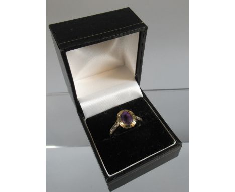 9ct gold dress ring set with an oval amethyst.  Ring size O.  Approx weight 3.1 grams.(B.P. 21% + VAT) 