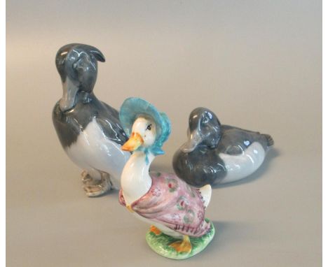 Two Royal Copenhagen porcelain studies of ducks, together with a Beatrix Potter's 'Jemima Puddleduck' figurine. (3)(B.P. 21% 