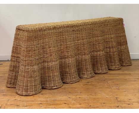 A contemporary ripple rattan console table, in the manner of Soane, the rectangular top over undulating front and sides. H77c